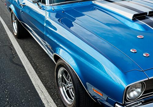 Racing stripes on blue muscle car